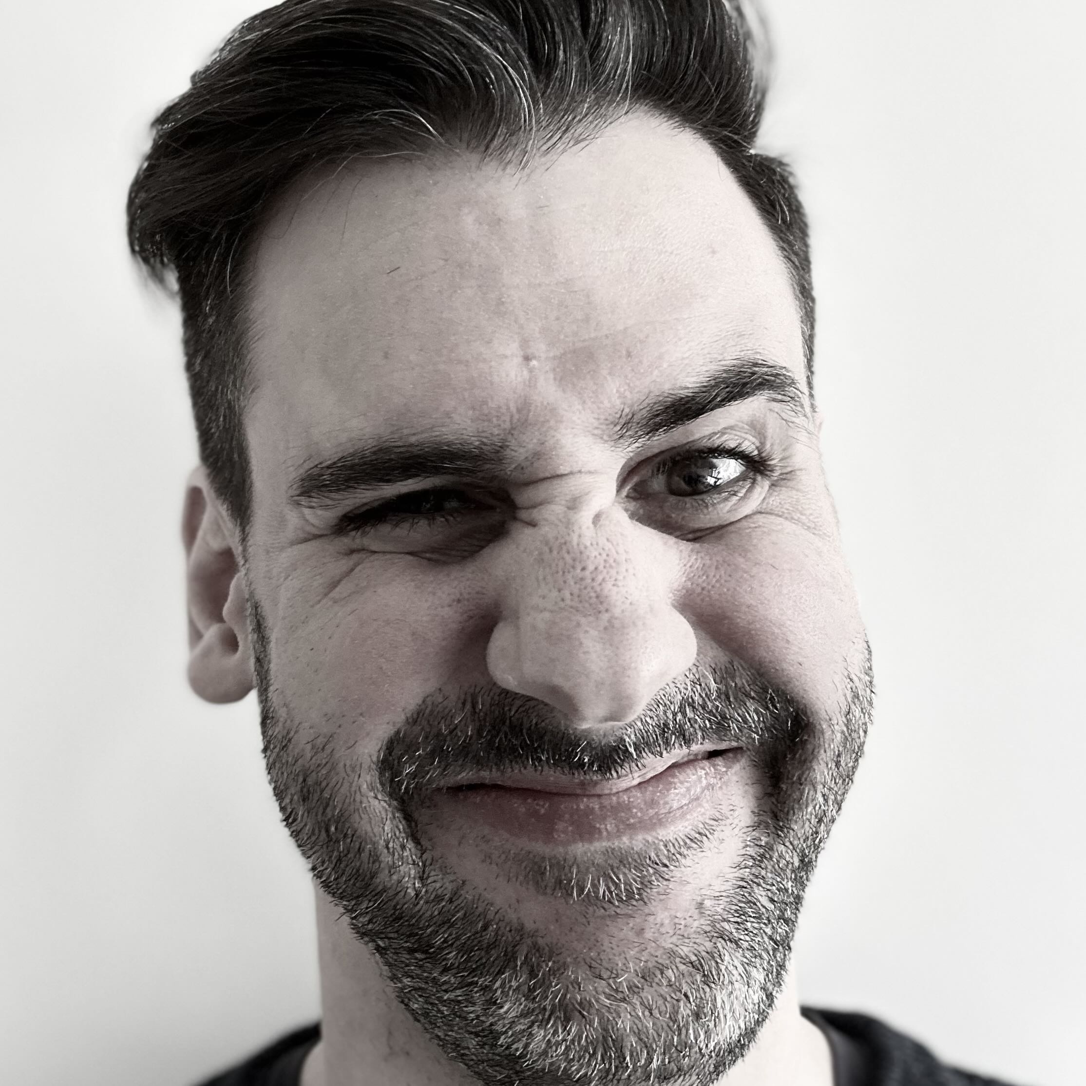 A photo of me. I am smiling but also scrunching up my face because I cannot take anything seriously.